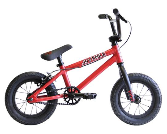 A red BMX bike with black grips and a padded seat, equipped with a chain and sprocket, designed for juveniles.